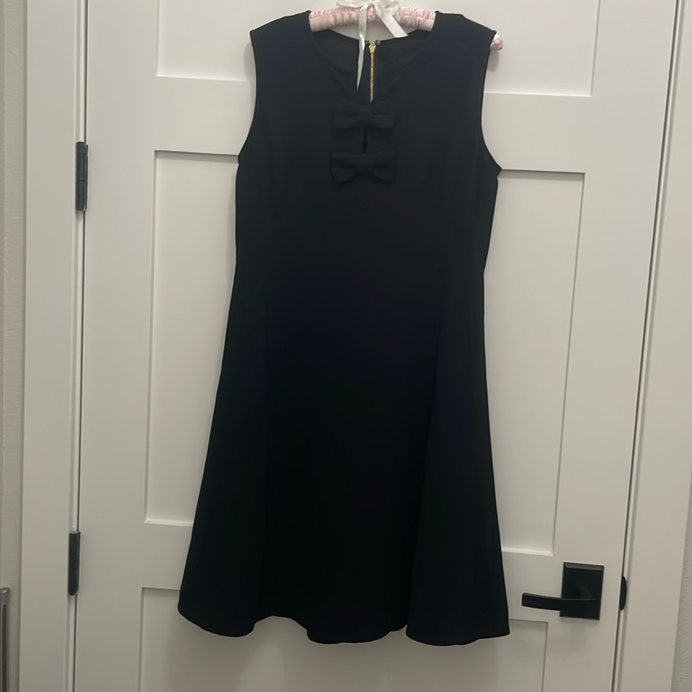 Black Cocktail Dress sleeveless with bow accents and gold tone zipper!